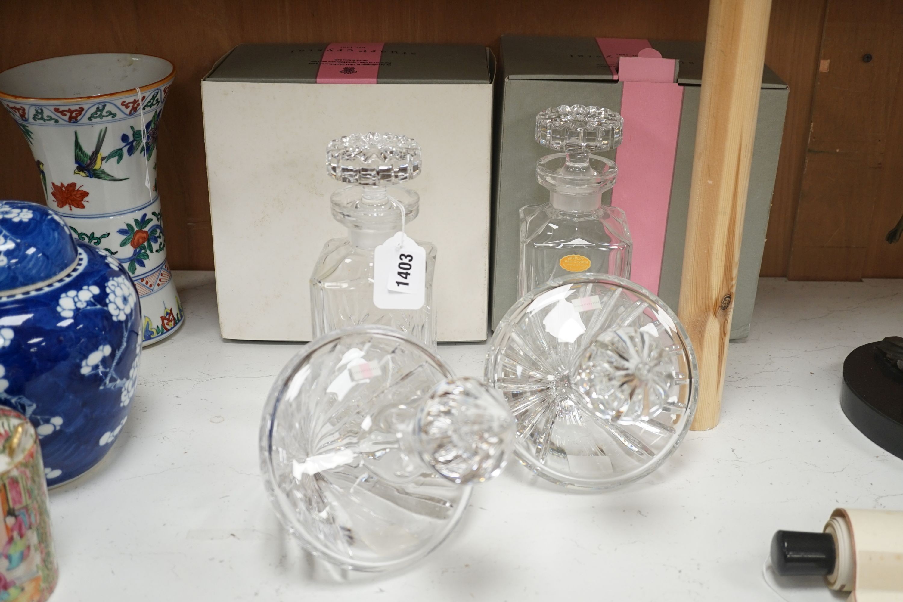 A pair of spirit decanters and a boxed pair of novelty Stuart 'rest' decanters.